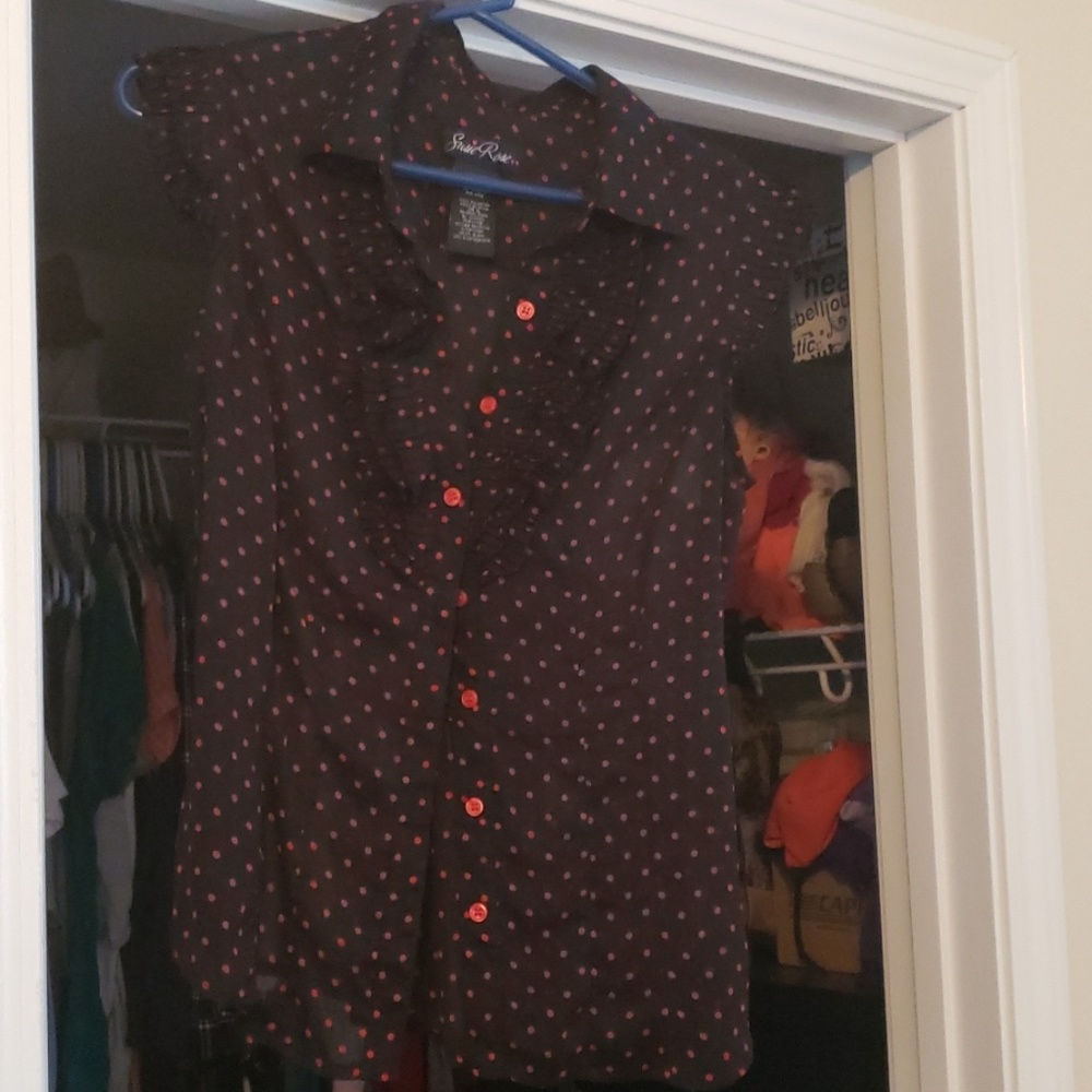 Red polka dot and black ruffled blouse